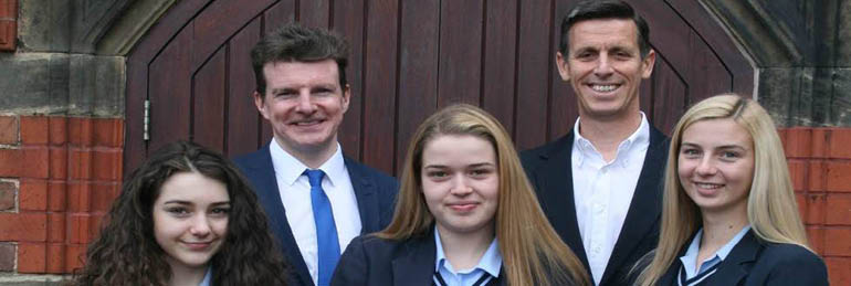 Caitlin and two other schoolgirls smiling - Caitlin Winner of Fantasy Investment League