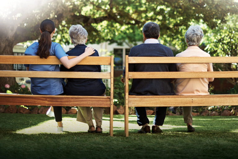 two people sat on a bench mirrored